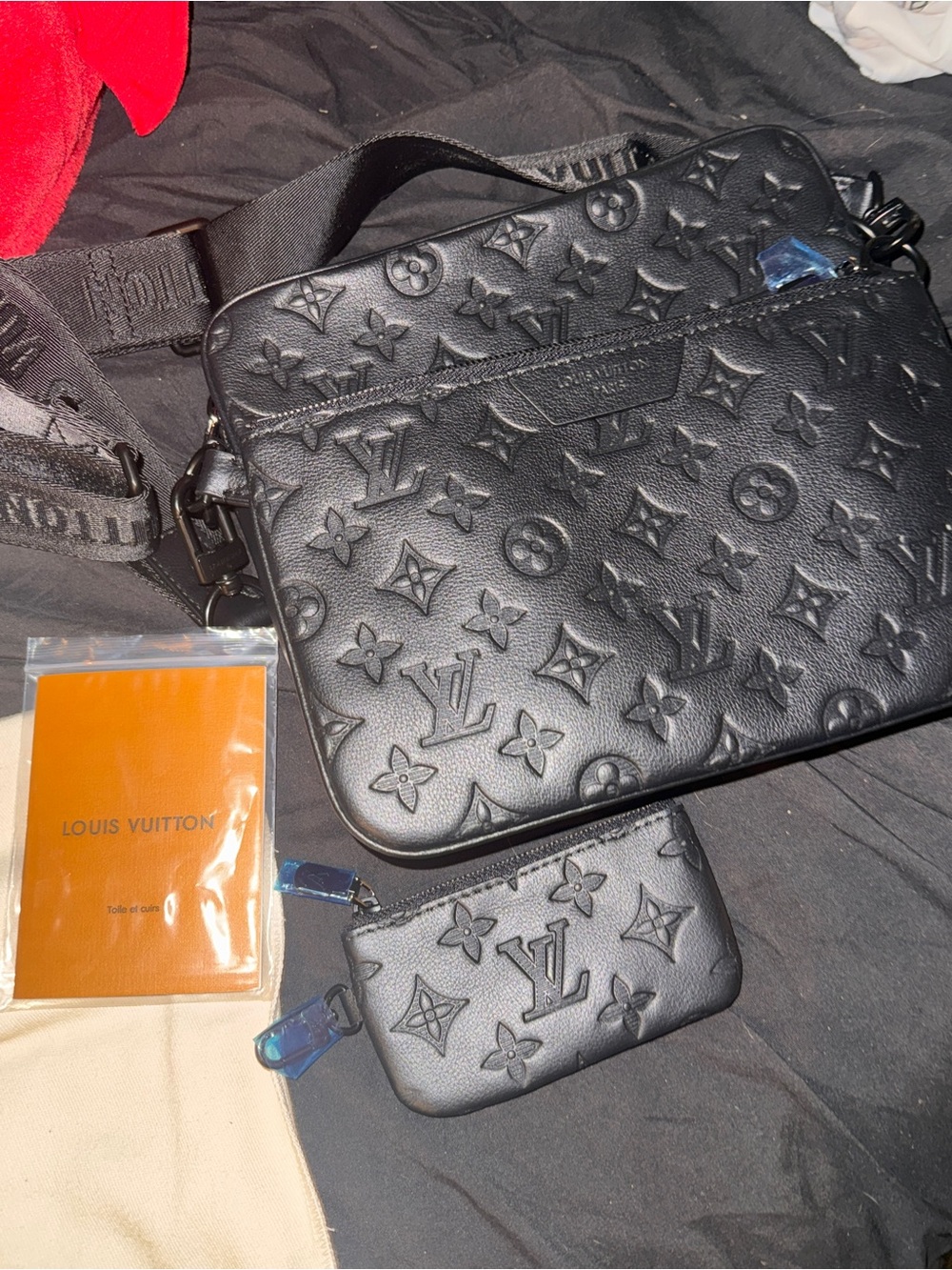 black Louis Vuitton Trio Messenger bag crafted from soft, embossed Monogram
